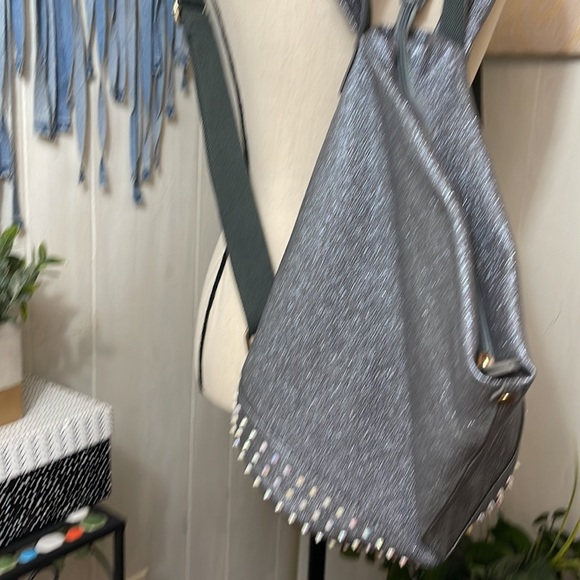Metallic silver and multi color stud fold over backpack. Vegan leather. - Picture 3 of 5